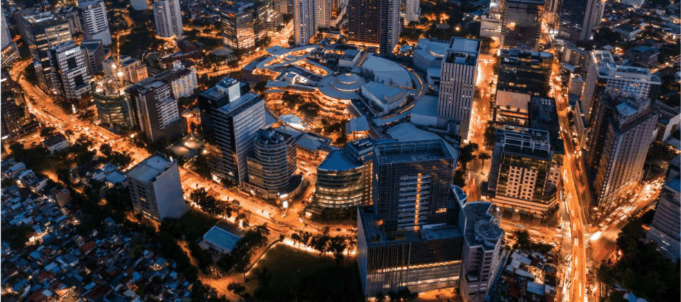 Aerial night view of Cebu City high-rises and lit streets