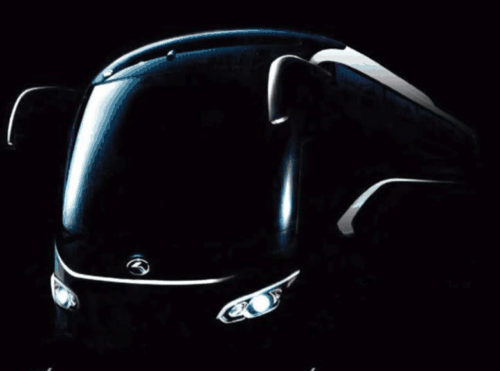 Front of a coach bus lit against a black background, Catalina Car Rentals advertisement