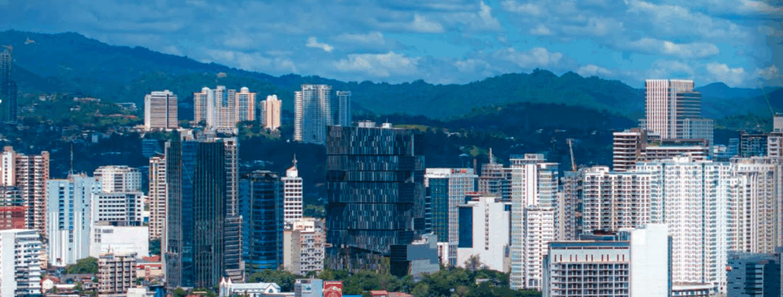 Cebu City high-rise skyline with green mountains behind
