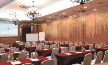 Jpark Island Resort meeting room with red-draped tables in classroom setup