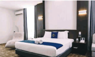 Premier Suite bedroom at Mezzo Hotel