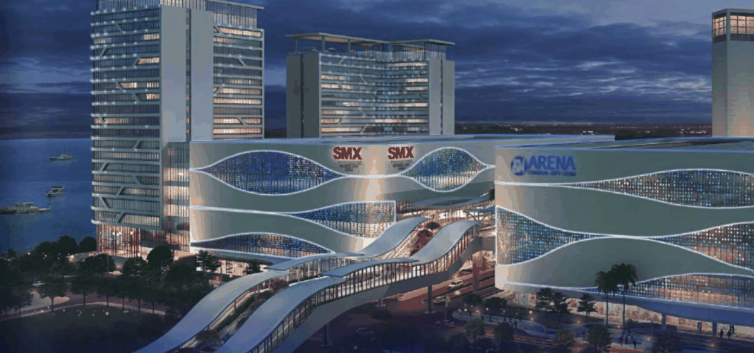 Night render of SMX Convention Center Seaside Cebu and SM Arena beside the sea