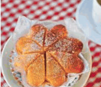 Sugar-dusted torta cake cut into slices